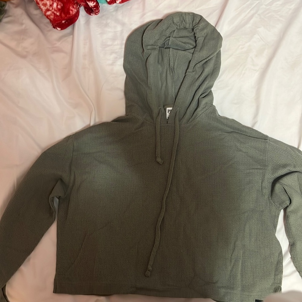 i’m selling a cropped see threw sweater